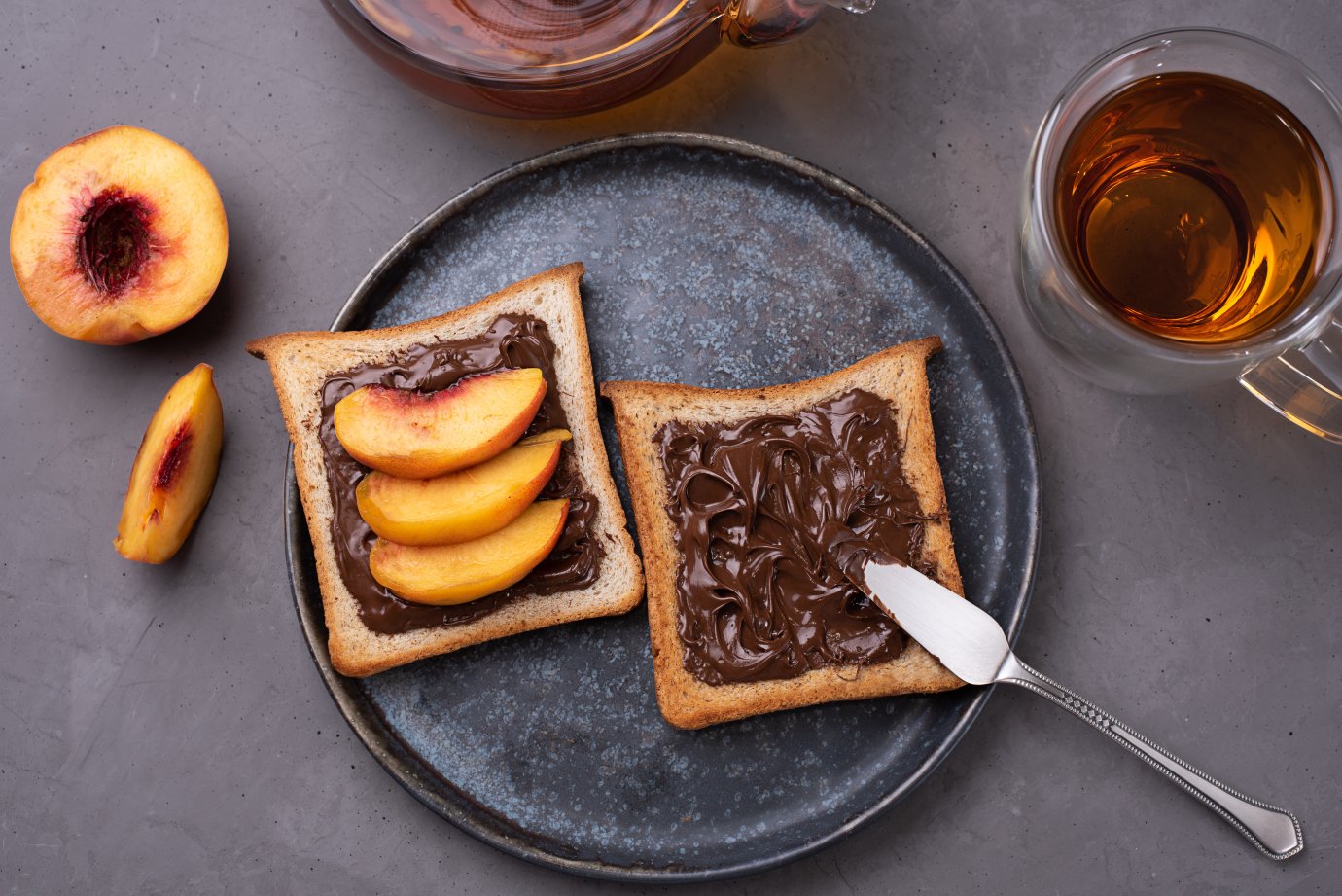 plate-toast-with-chocolate-paste-with-peach-slices-plate-with-cup-tea-gray-concrete-background.jpg plate-toast-with-chocolate-paste-with-peach-slices-plate-with-cup-tea-gray-concrete-background.jpg